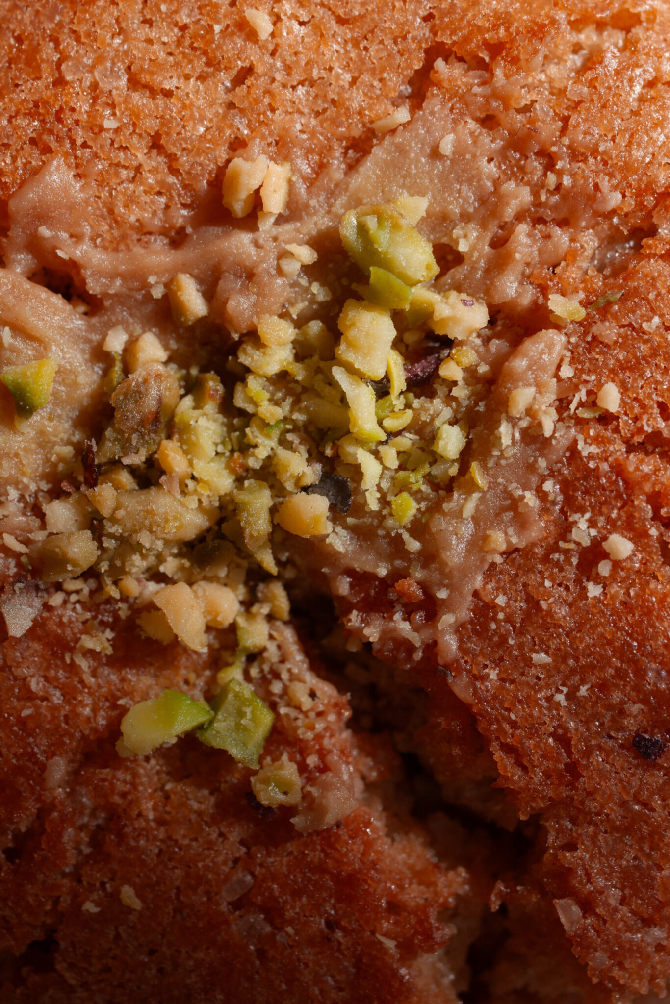 Food photography. Macro image of a Monette Valencia's pistache cookie, warm colors